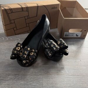 Melissa Black Flats with Gold Floral Accents